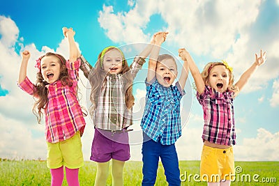 Cute happy kids are jumping together Stock Photo