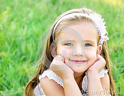 Cute happy little girl on the meadow Stock Photo