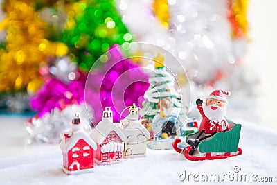 Cute happy Santa Claus dolls and Christmas props decorations on Stock Photo