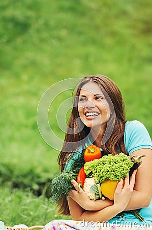 Cute happy woman with organic healthy vegetables Stock Photo