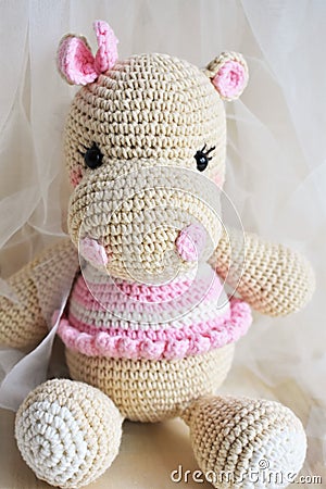 Cute Hippopotamus crochet in vintage background. Toy for kids. Hippo knitting. Handmade. Hippie soft toy Cute woolen. Hippie baby Stock Photo
