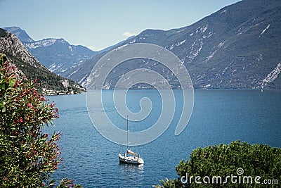 Cute idyllic Italian village and lake captured from the water. Limone at lago di Garda Stock Photo