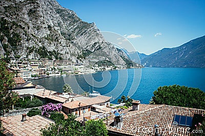 Cute idyllic Italian village and lake captured from the water. Limone at lago di Garda Stock Photo