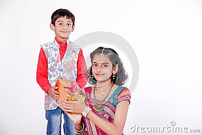 Cute Indian brother and sister celebrating raksha bandhan festival , Stock Photo