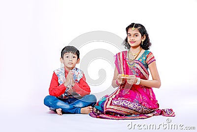 Cute Indian brother and sister celebrating raksha bandhan festival , Stock Photo