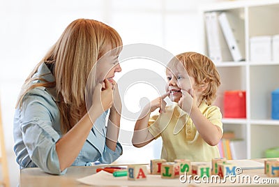 Cute kid little boy at speech therapist office Stock Photo