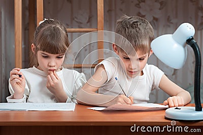 Cute kids do their homework Stock Photo