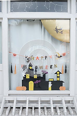 Cute kids paper crafts display at nursery house's window for celebrating on October 31, Halloween day. Editorial Stock Photo