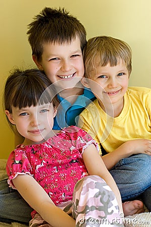 Cute kids sitting close Stock Photo