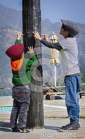 Cute kids wearing caps and having fun Editorial Stock Photo