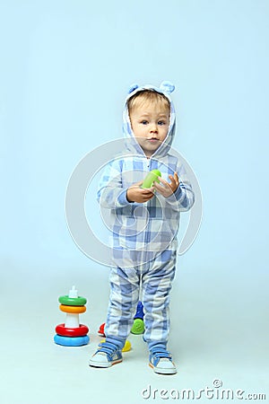 Cute little baby boy wearing on sleepwear standing. Stock Photo
