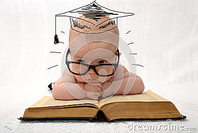 Cute little baby in glasses with painted professor hat Stock Photo