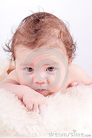 Cute little baby todler infant lying on blanket Stock Photo