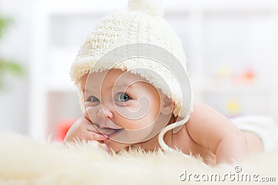 Cute little baby looking into the camera and Stock Photo