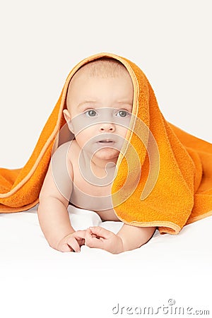 Cute little baby. Under bath towel. Happy kid portrait. White background Stock Photo