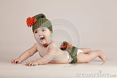 Cute little babygirl having fun and smiling on isolated background Stock Photo