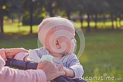 St. Petersburg, Russia, August 5, 2019.Cute little blond boy is walking in the clear summer weather in the park. The Editorial Stock Photo