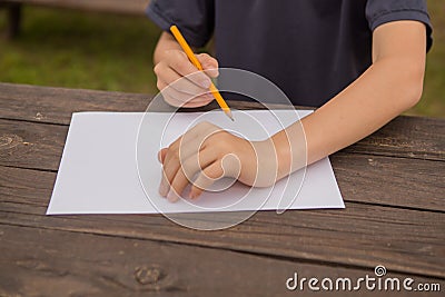 Cute little boy drawing at home. Children`s creativity. Creative kid painting at preschool. Development and education concept.Happ Stock Photo