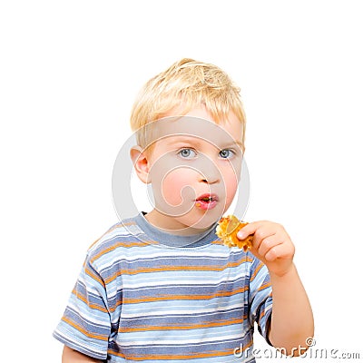 Cute little boy eating delicious cookie isolated Stock Photo