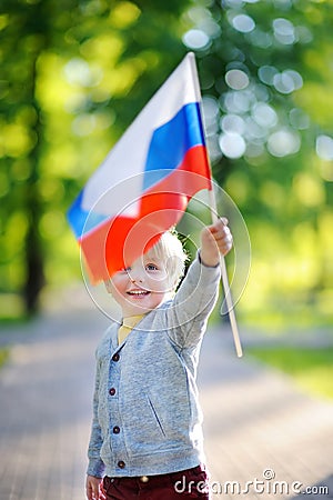 Cute little boy holding russian flag Stock Photo