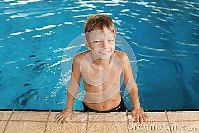 Cute little boy in indoor pool Stock Photo