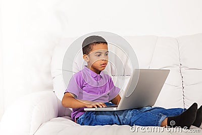 Cute little boy with laptop Stock Photo