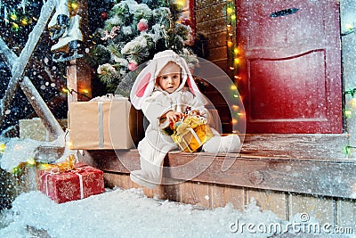 Sitting on porch rabbit boy Stock Photo