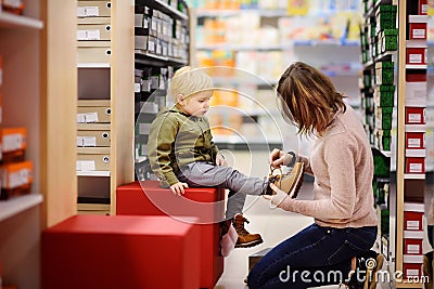 Cute little boy during shopping with his young mother Stock Photo