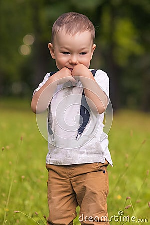 Cute Little Boy Shying Stock Photo