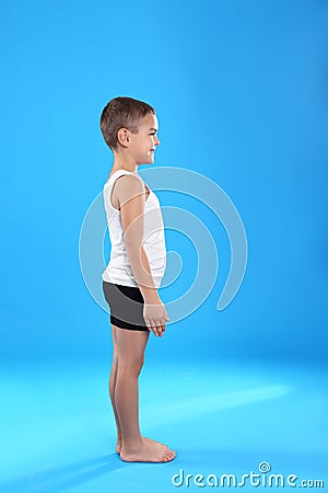 Cute little boy in underwear on light blue background Stock Photo