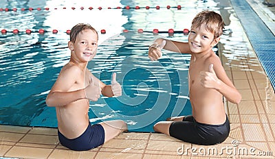 Cute little boys near indoor pool Stock Photo