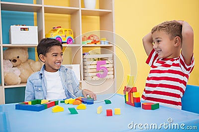 Cute little boys playing with building blocks Stock Photo