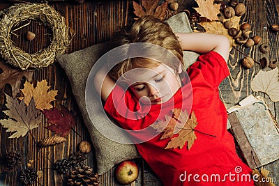 Cute little child boy are getting ready for autumn. Child advertise your product and services. Blonde little boy resting Stock Photo