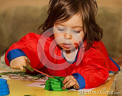 Cute little child drawing and studying at daycare Stock Photo