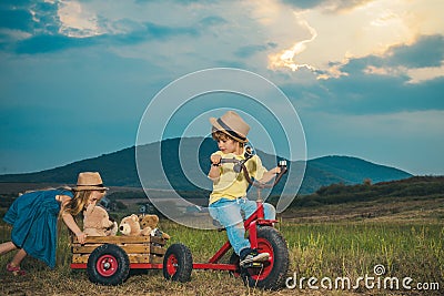 Cute little children enjoying on farm. Childhood memories. Eco resort child activities. Little farmer in village. Summer Stock Photo