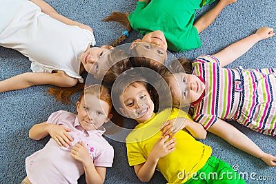 Cute little children lying on floor Stock Photo