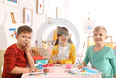 Cute little children painting at table Stock Photo