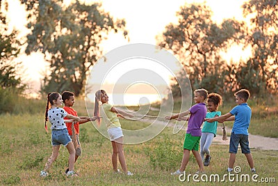 Cute little children playing outdoors Stock Photo