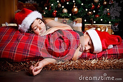 Cute little children waiting for Christmas presents Stock Photo