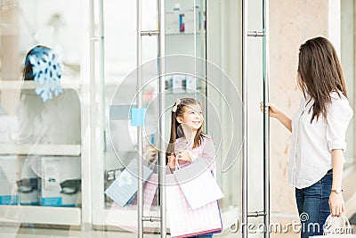 Cute little doing shopping with her mother Stock Photo