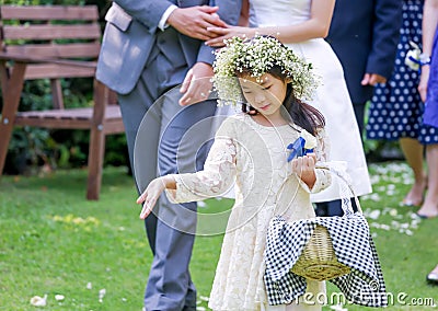 Cute little flower girl Stock Photo