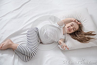 Cute little girl in bed woke up in the morning Stock Photo