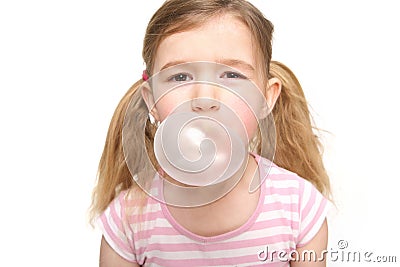 Cute little girl blowing a bubble from chewing gum Stock Photo