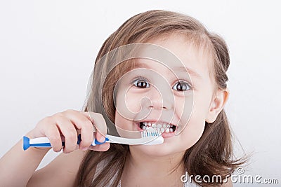 Cute little girl brushing his teeth Stock Photo