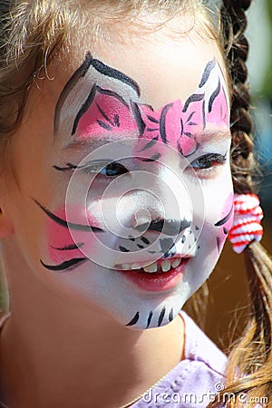 Cute little girl with cat makeup Stock Photo