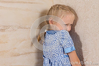 Cute Little Girl in Dress Isolated on Wooden Walls Stock Photo