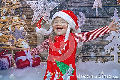 Cute Little Girl dressed in red dress bringing the Christmas spirit. Stock Photo