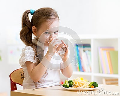 Cute little girl drinking water Stock Photo