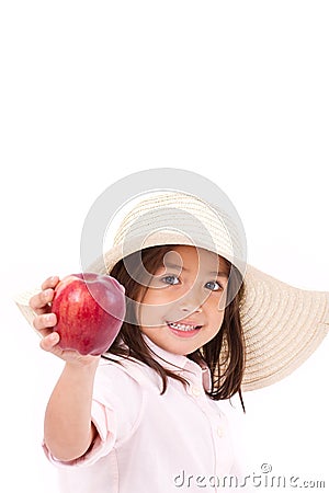 Cute little girl, hand holding red apple with text space Stock Photo