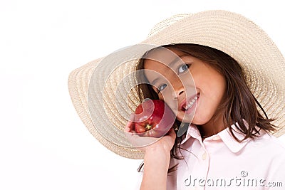 Cute little girl, hand holding red apple Stock Photo